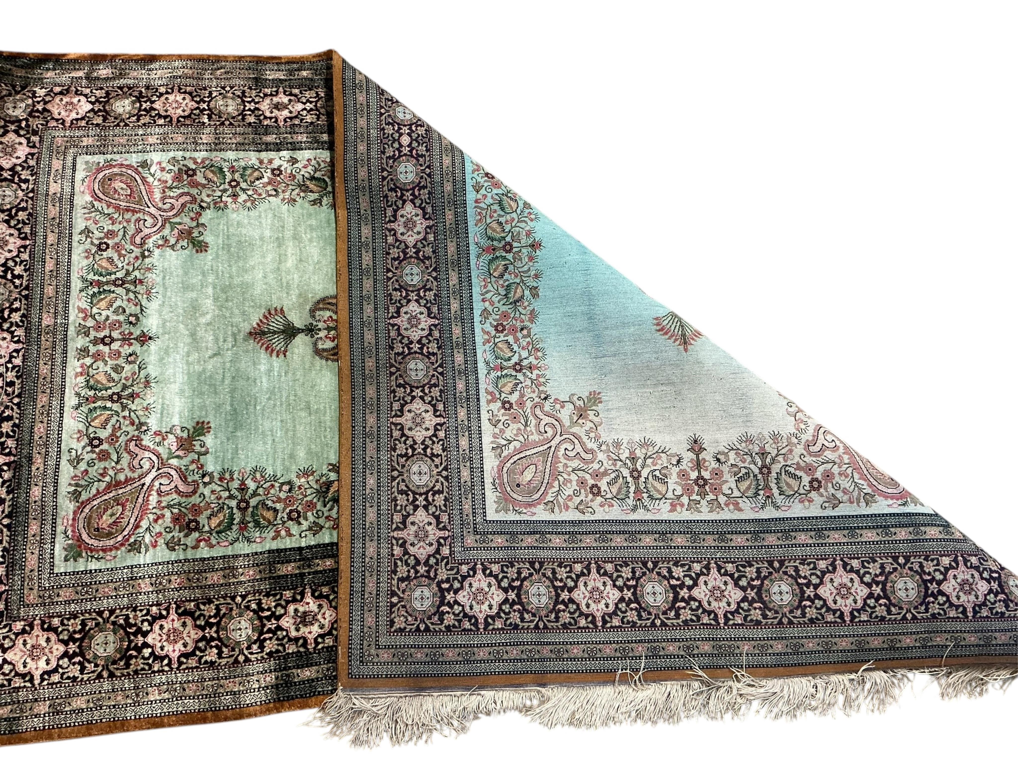 A North West Persian part silk Naeen-Ghom pale green ground rug, 160 x 98cm